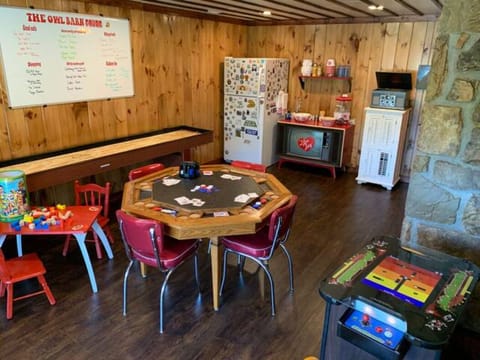 Big game room with arcade, shuffleboard table & poker/bumper pool table