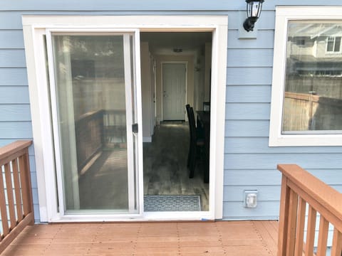 Looking from the patio into the living/dining/kitchen area.