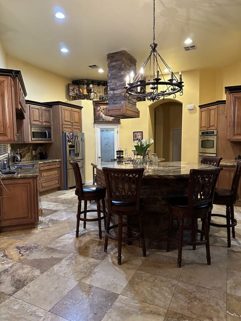 Kitchen with island and stools