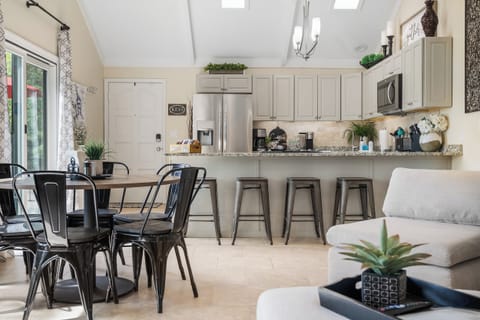 Dining Table with 6 chairs and 5 Stools at the Kitchen Counter