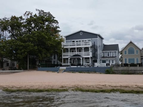 A beach house symphony of sun-bleached wood, salty air, and endless shades of blue. The perfect place to soak up the summer sun.