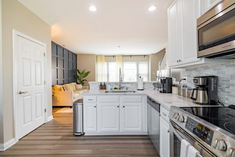 A stylish and practical kitchen, fully stocked for your next delicious meal or snack!