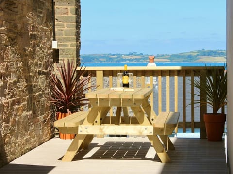 Outdoor decking directly from front door with outstanding views across the bay.. including Pendennis Point, the docks, views over to St Mawes and the Carrick Roads.