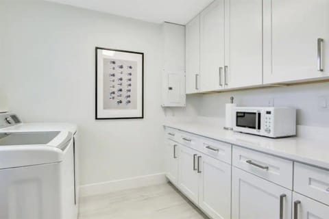 Fully- equipped laundry room with large capacity washer and dryer, iron and board, microwave, all detergents you need.