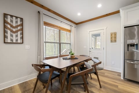 Dining table seats 6 with additional seating at the bar