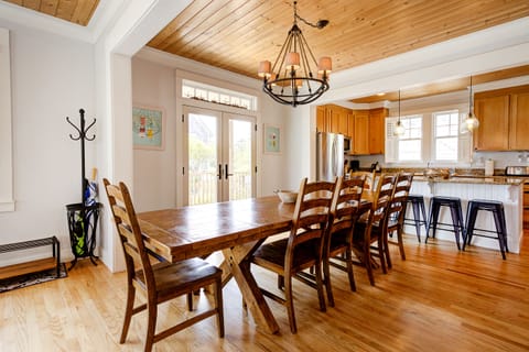 The large dining table is perfect for meals, laughter and memories