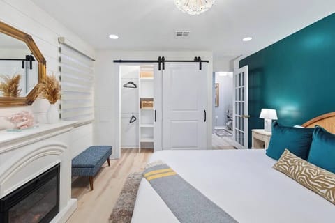 Master Bedroom with King Bed. Closet with organizer and washer/dryer. Electric fireplace for ambiance or extra heat in the winter months.