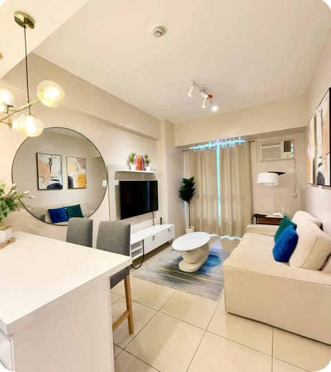 Relax in a thoughtfully designed living room with Tv, sofa, coffee table
