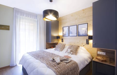 Relax on the fluffy bed after a fun-filled day outdoors.