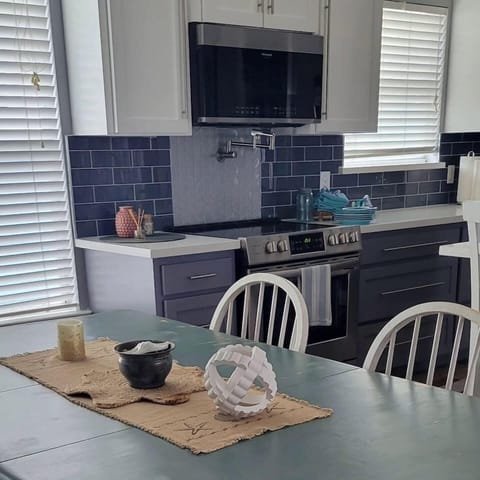 Bright and stylish space for culinary adventures with modern appliances and lively decor!