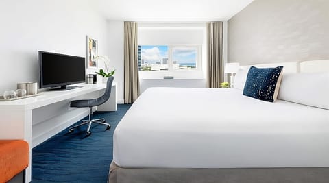 Lounge into crisp bedding with a bright, airy layout.
