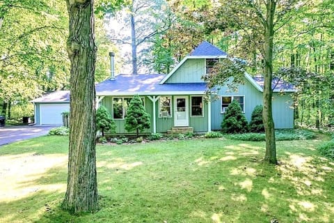 Cottage set back from road. Lots of mature trees/privacy. 