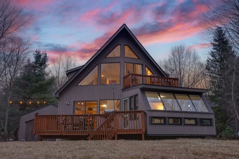 This beautiful and spacious cabin has it all... from the cowboy cabin filled with games, to kayaks, a grill, an outdoor fire-pit, lakeside views, and more!