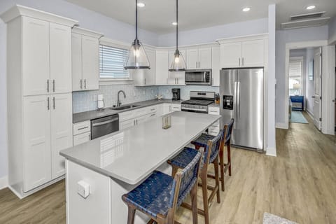 The kitchen offers beautiful granite countertops with stainless appliances, and an additional 3 seats at the kitchen island!