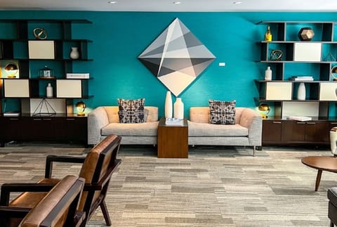 Gather for coffee in a vibrant lounge with designer details.