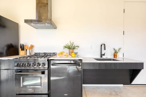 Kitchen features a gas range.