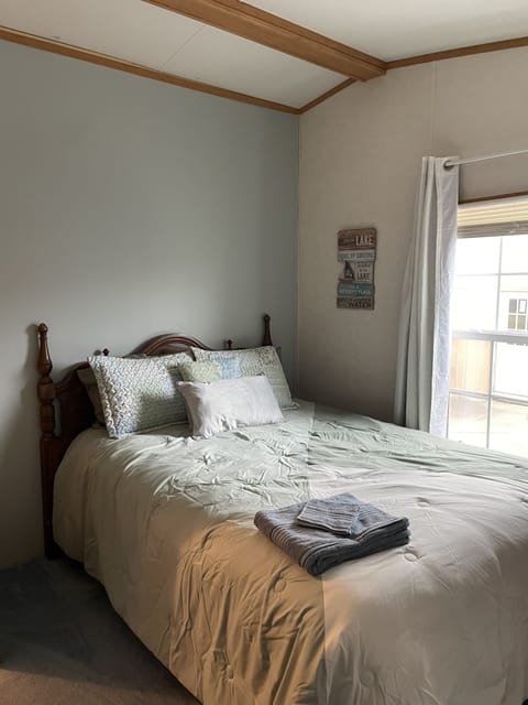 Third bedroom has a queen bed, dresser and walk in closet.