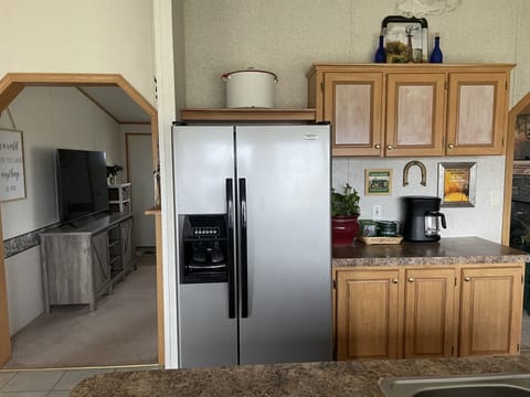 Dishwasher, coffee pot and plenty of cooking utensils.