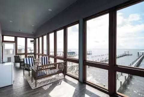 Enjoy sunrises and sunsets on the screened-in porch. 