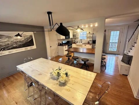 Open kitchen and dining room. Seats for 8 in the dining table. Island with more.