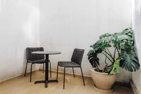 Charming private patio with seating area, perfect for morning coffee or evening chats.
