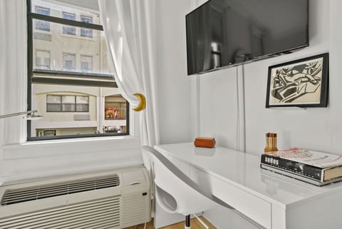 Smart Flatscreen Tv and workspace area. AC
