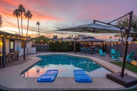 Beautiful resort backyard equipped with a heated pool (please inquire about extra charges), lounge chairs, pool toys, pergola with kitchenette, outdoor BBQ & outdoor fridge. Outdoor area includes big outdoor umbrella.  Also plenty of seating outdoors for 