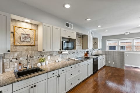 This large kitchen hosts two sinks, double oven and plenty of space