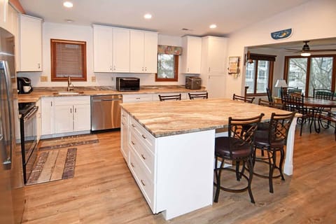 Pictures don't do justice to our beautiful, brand new kitchen. Island sits 6!