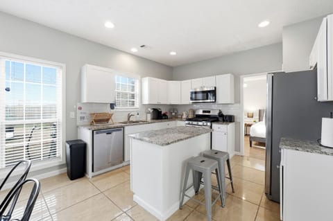 Dining space with natural light and open access to the living room.