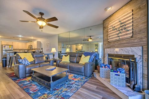 Relax in the spacious and stylish living area with plush seating and vibrant rug
