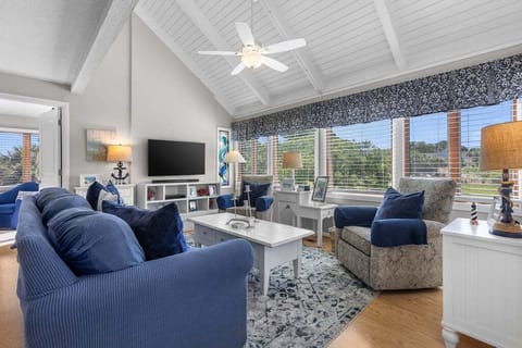 The great room has soaring ceilings, plenty of comfortable seating to take in the amazing views.Unwind in style with front-row seats to the greens.