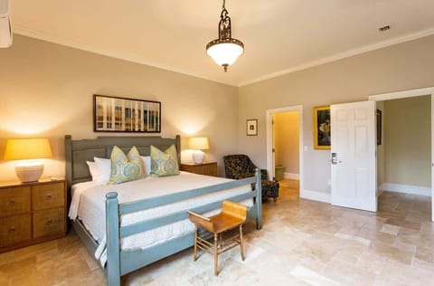 - Relax in the peaceful ambiance of the beautifully furnished bedroom of the suite in Naples Florida
- Feature a king-size bed and small office space with a desk, designed for your ultimate convenience
- Serene bedroom with a tranquil color palette