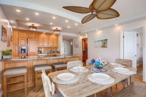 Dining room adjacent from the fully equipped kitchen with seating for 4 guests at the breakfast bar and 6-8 at the dining table.