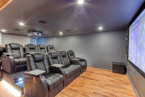4K Movie Theater with 8 powered recliners. State of the art audio/visual