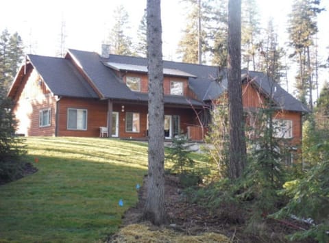 Lake side of the house with sprawling lawn to run and play and enjoy.