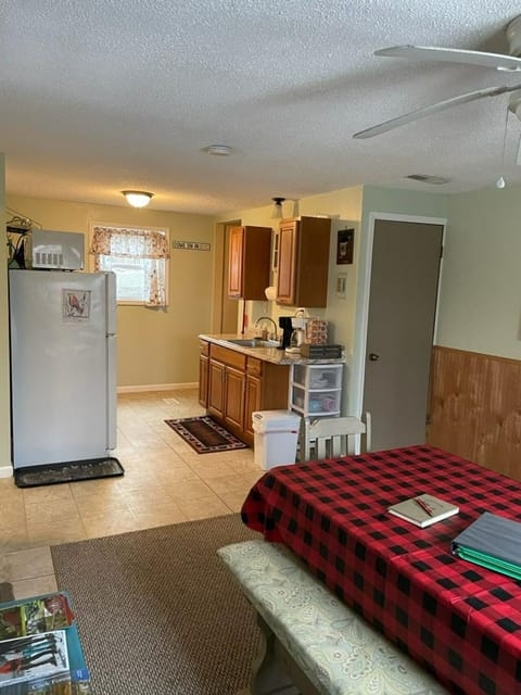 Our kitchen equipped with a gas range, a refrigerator, and a small pantry.