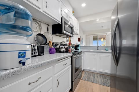 Kitchen with pass-through to dining area.
