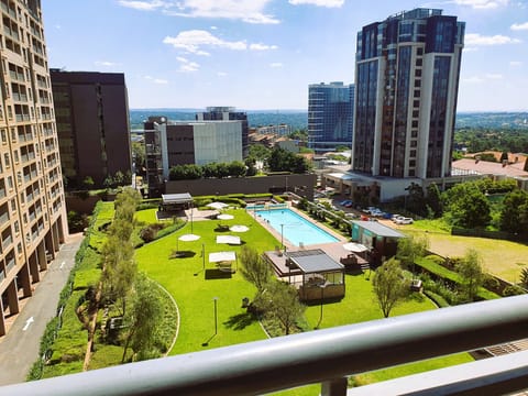 view of pool and garden area