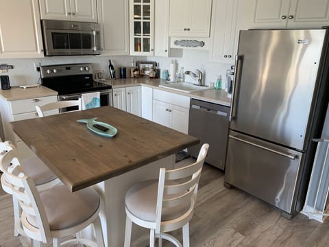 Fully equipped kitchen with stainless appliances 