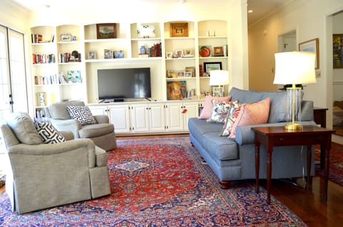 Large living room. Connects to the dining room, kitchen, and large backyard. 