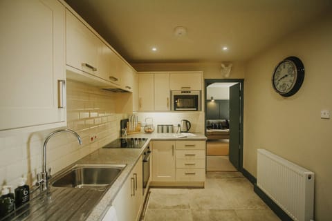 Open plan kitchen with access to lounge