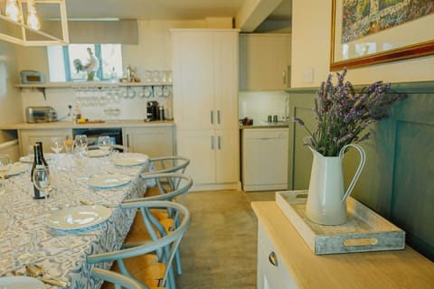 Ground floor: Open plan kitchen with oven, 4 ring hob, fridge, freezer, microwave & dishwasher