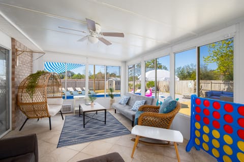 Sun drenched haven boasting poolside panoramas & array of cozy seating options