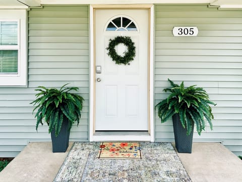 Fresh porch plants and rug - welcome!