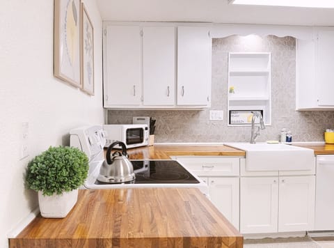 Spacious and fully equipped kitchen. Full sets of baking pans, pots, and utensils provided.