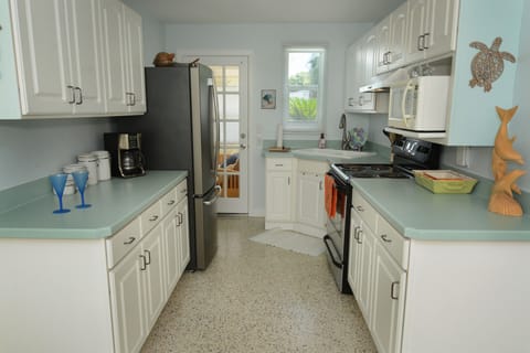 standing in the living room facing kitchen. back door goes out to florida room 