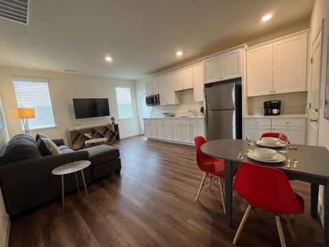 Private entrance door opens to the living, dining and kitchen area.