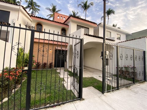 Frontal view, parking at the right side of the house. 