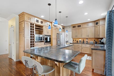 Our open concept kitchen is fully updated with modern counter tops, storage, and appliances.